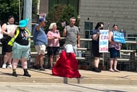 Green Bay Handmaid strikes powerful image at protest post image