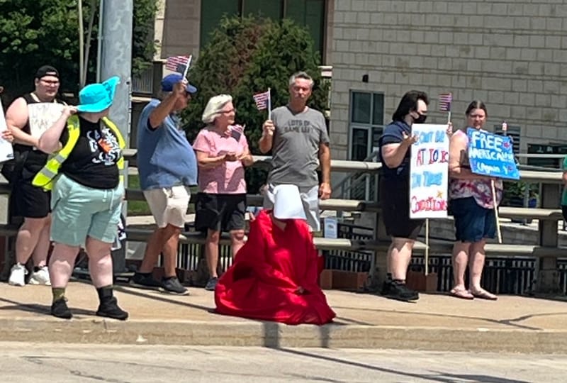 Green Bay Handmaid strikes powerful image at protest post image