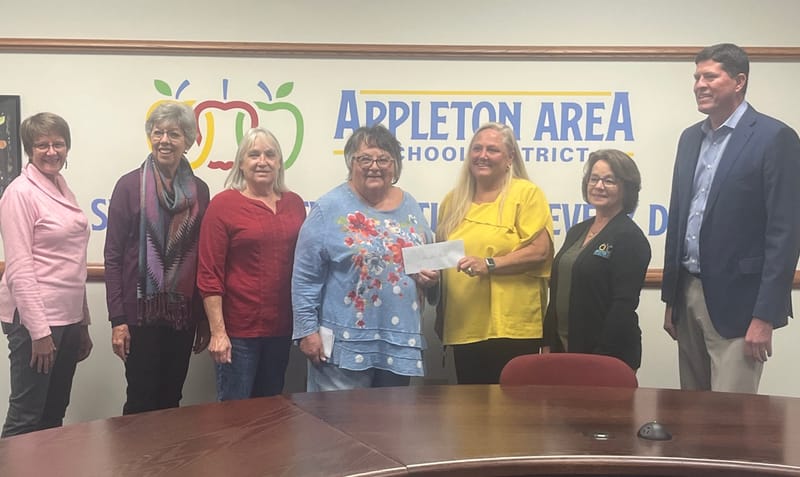 Neighborhood group presents check to help AASD with debt post image